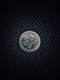 High angle view of coin on table