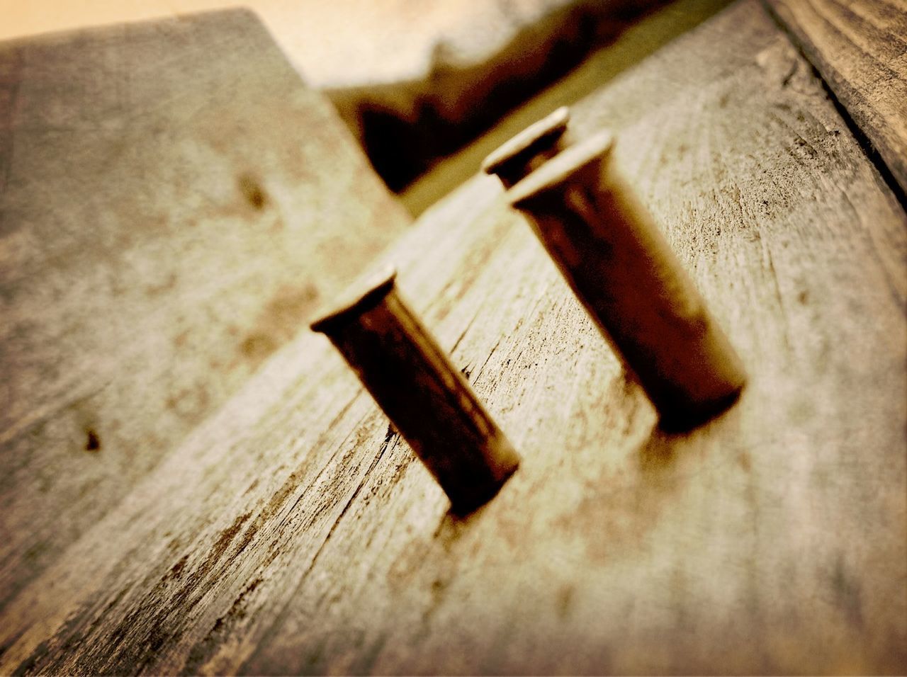 indoors, wood - material, still life, close-up, table, wooden, selective focus, wood, high angle view, metal, old, plank, single object, no people, work tool, focus on foreground, brown, nail, rusty, equipment