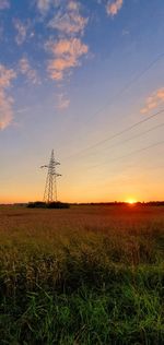 Scenic view of field against sky during sunset