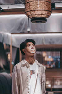 Portrait of young man looking away