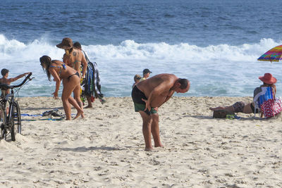 People enjoying on beach