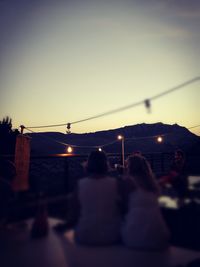 Silhouette of woman at sunset