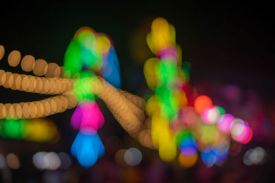 Defocused image of illuminated lights at night