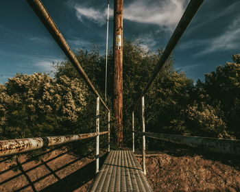 Railroad track against cloudy sky