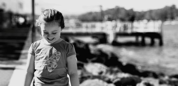 Smiling cute girl standing outdoors