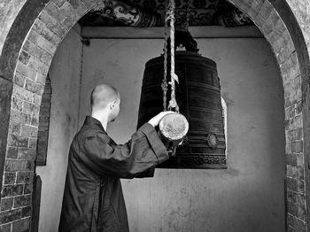 Kung fu master ringing bell at shaolin temple greece
