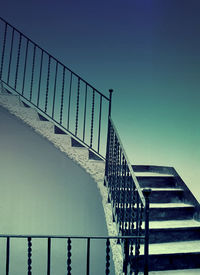 Low angle view of stairs against clear sky