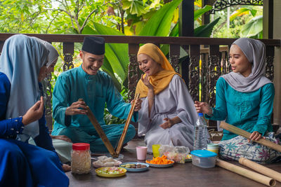 Group of people sitting on table