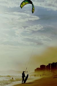 Man with umbrella on beach