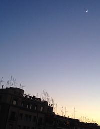 Low angle view of built structure against clear blue sky