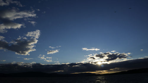 Scenic view of sea against sky at sunset