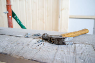 Close-up of hammer on wood