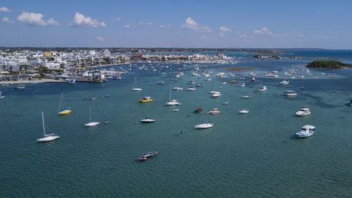 High angle view of sailboats in sea against sky