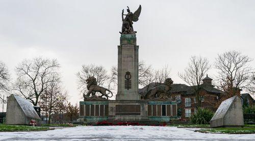 Statue in city during winter