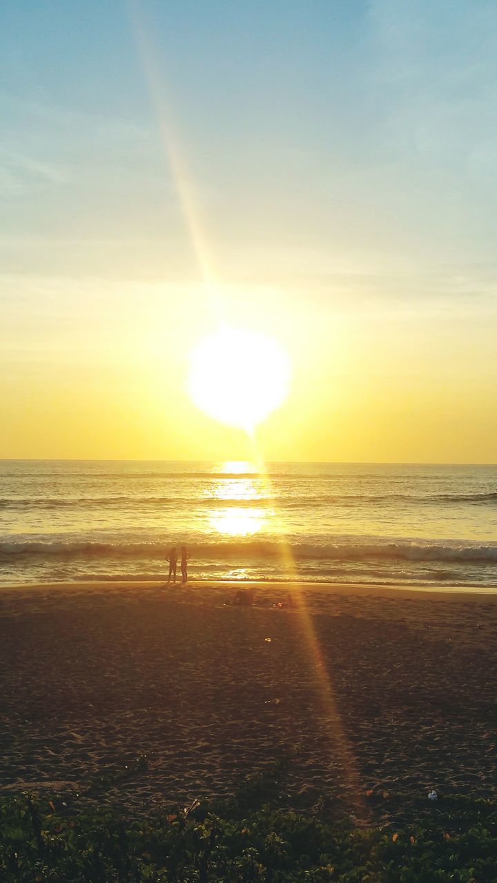 sea, horizon over water, beach, water, sunset, sun, shore, scenics, sky, beauty in nature, tranquil scene, tranquility, idyllic, sunlight, sand, nature, reflection, orange color, incidental people