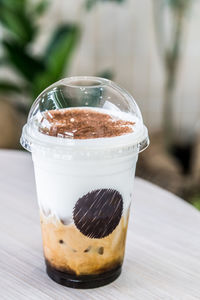 Close-up of coffee in glass on table