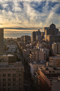 Cityscape against sky during sunset