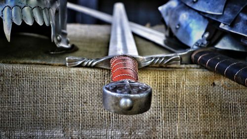 Close-up of padlocks hanging on metal