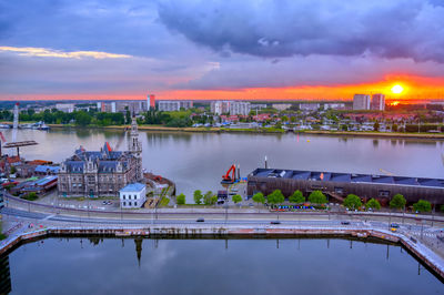 Scenic view of river against sky during sunset