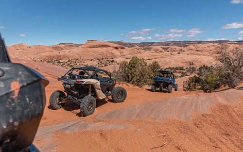 Full frame view of tourists enjoying a 4x4 trail on a sunny day in rugged terrain