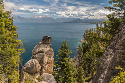 Scenic view of sea against cloudy sky