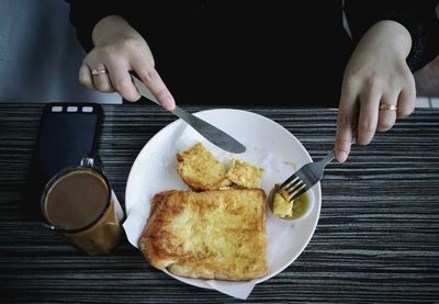 Cropped image of person preparing food on table