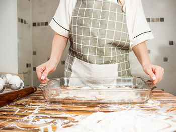 Midsection of man preparing food