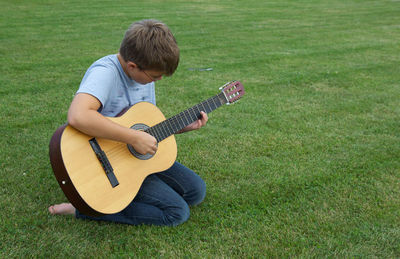 Boy playing guitar