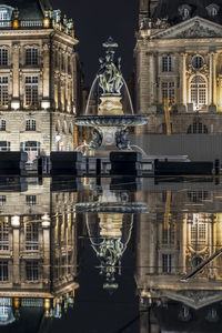 Digital composite image of statue in city