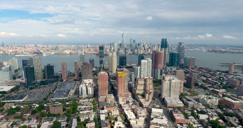 High angle view of modern buildings in city against sky