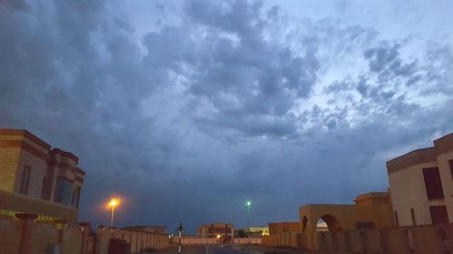 Low angle view of illuminated buildings against sky