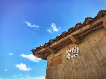 Low angle view of built structure against blue sky