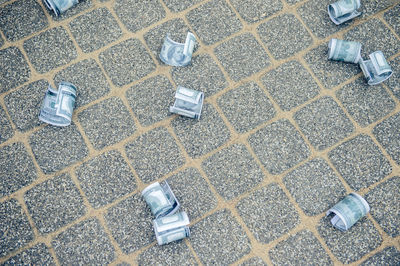 High angle view of paper currency on street