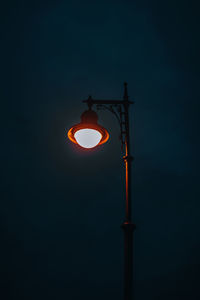 Burning street lamp against the background of the night sky