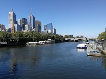 Modern buildings by yarra river in melbourne