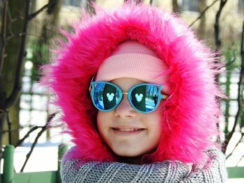 Portrait of smiling girls wearing fur coat