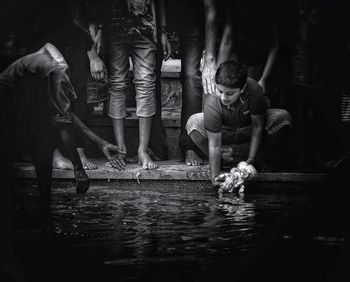 Rear view of people in water