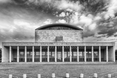 Palazzo dei congressi against cloudy sky