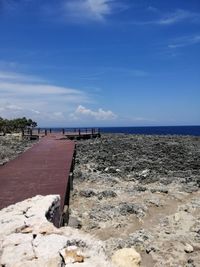 Scenic view of sea against blue sky