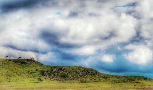 Scenic view of landscape against cloudy sky