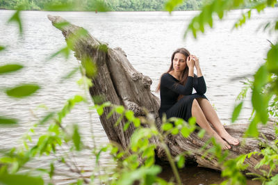 Portrait of woman sitting in water