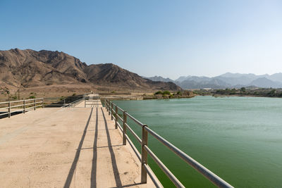 Scenic view of mountains against clear blue sky