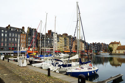 Boats moored at harbor