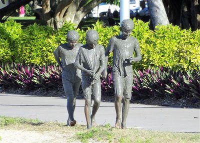 Statue of people in park