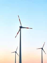 Low angle view of windmill against clear sky