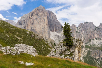 Scenic view of mountains against cloudy sky