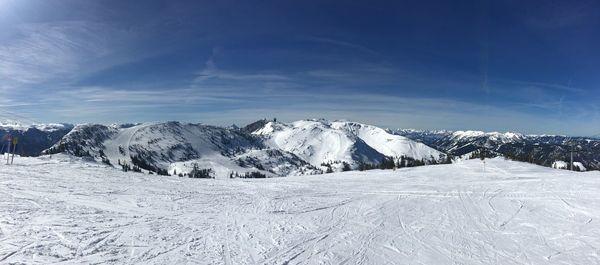 Scenic view of snow covered mountains against sky