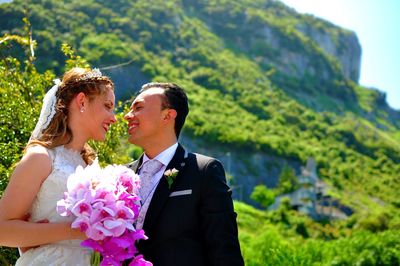 Side view of bride with bouquet