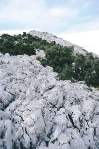 Rocks on mountain against sky