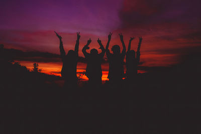 Silhouette people at sunset